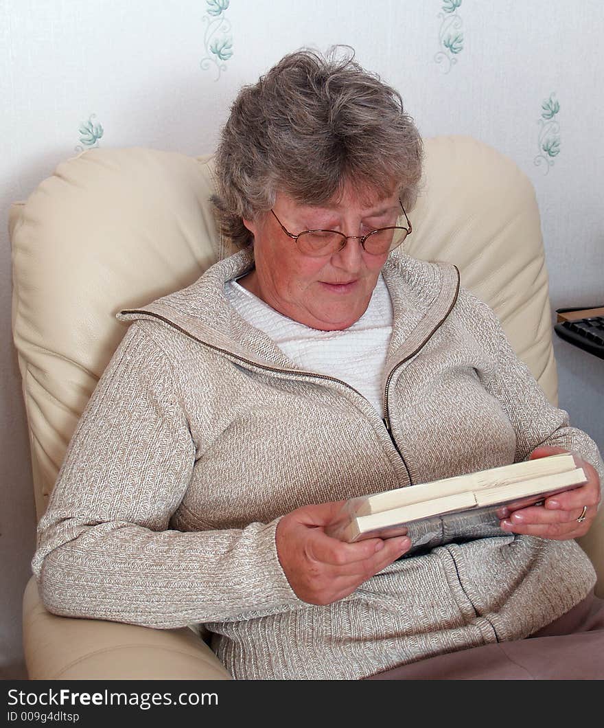 Elderly lady sorting out her christmas cards. Elderly lady sorting out her christmas cards