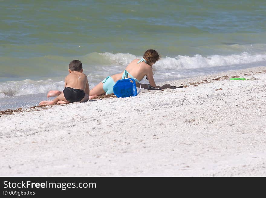 Boy and Girl Playing on the Beach