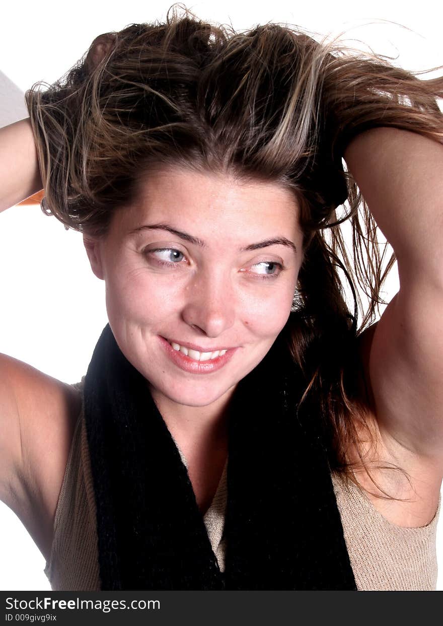 Smiling happy attractive woman holding her hair up. Smiling happy attractive woman holding her hair up