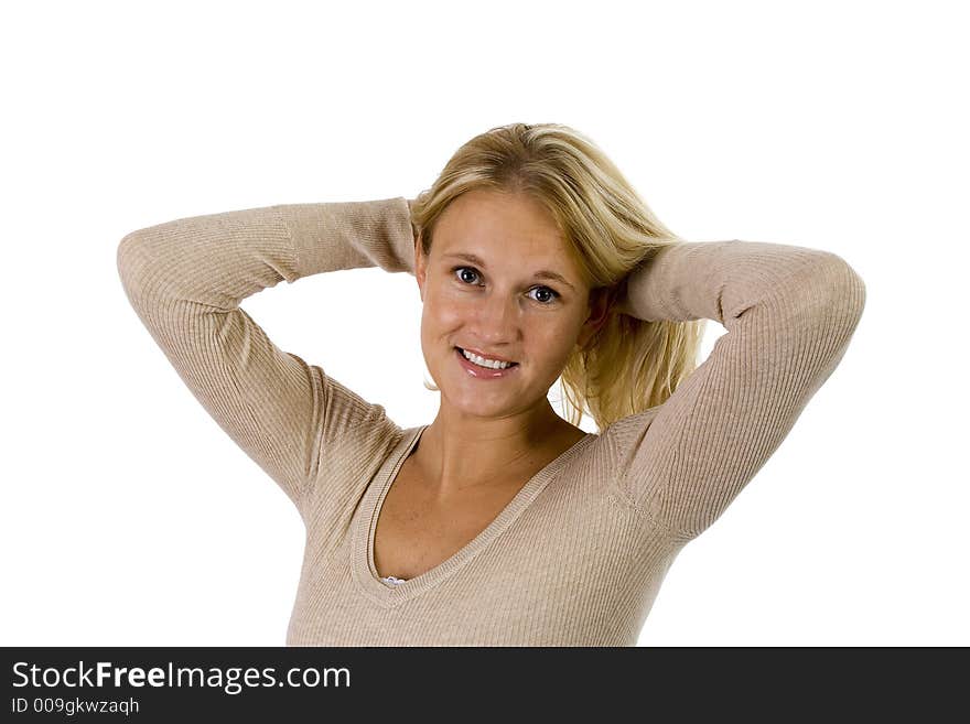 Beautiful blonde woman casual portrait with hands behind her head. Image isolated on white.