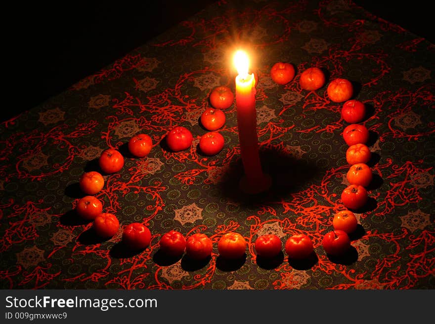 Full size heart made of fruits with a candle in the middle. Full size heart made of fruits with a candle in the middle