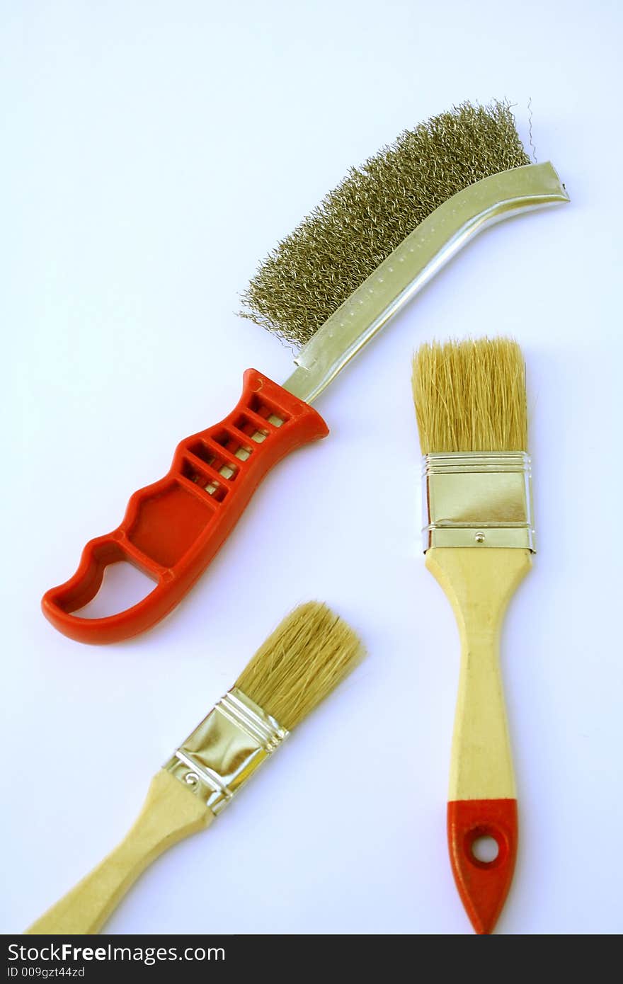 Two Painting Brushes And Metal Brush