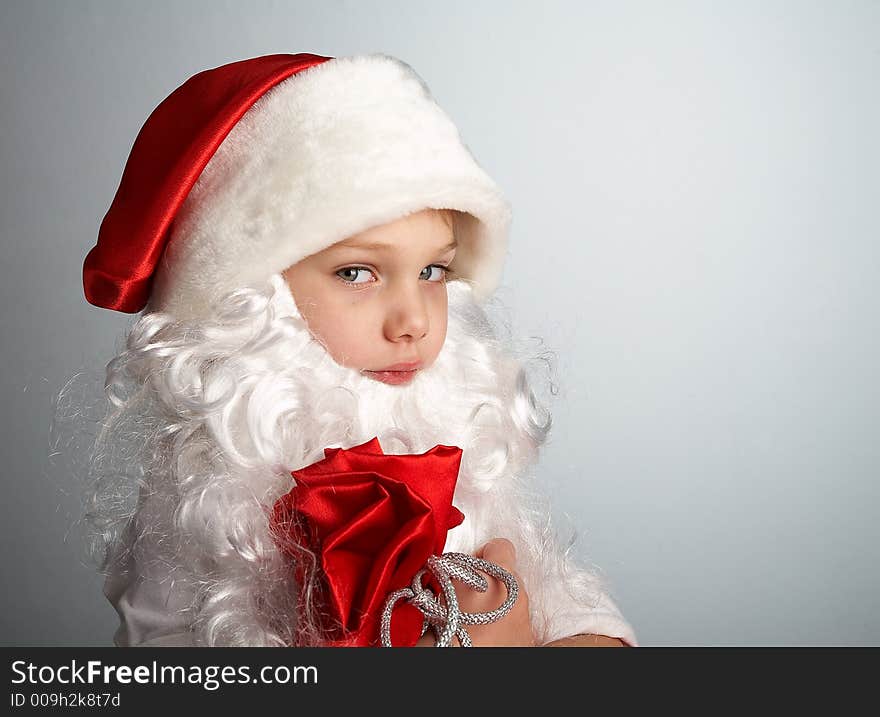 Small boy with santa's hat and bag full of gifts. Small boy with santa's hat and bag full of gifts