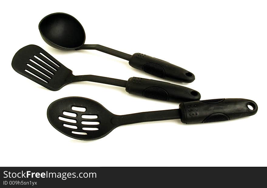 Three diferents plasic spoons for cook