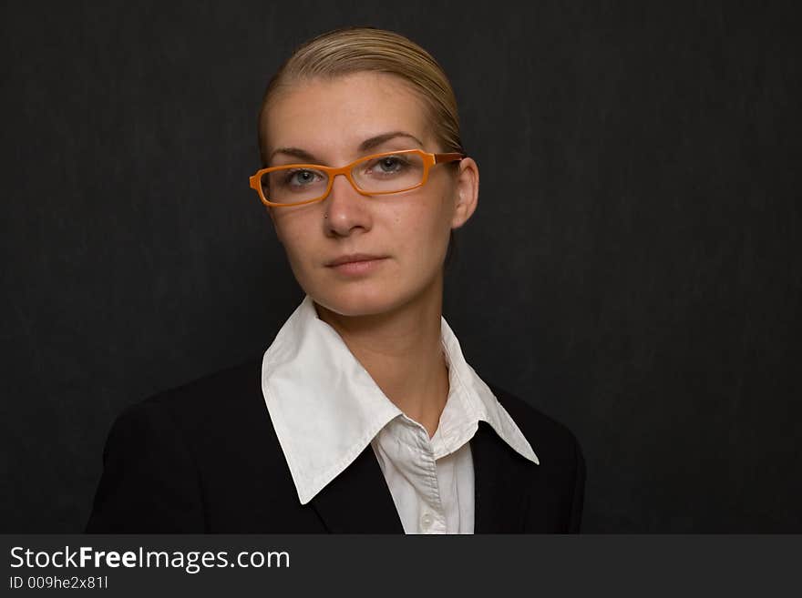 Picture of a business woman with orange glasses. Picture of a business woman with orange glasses