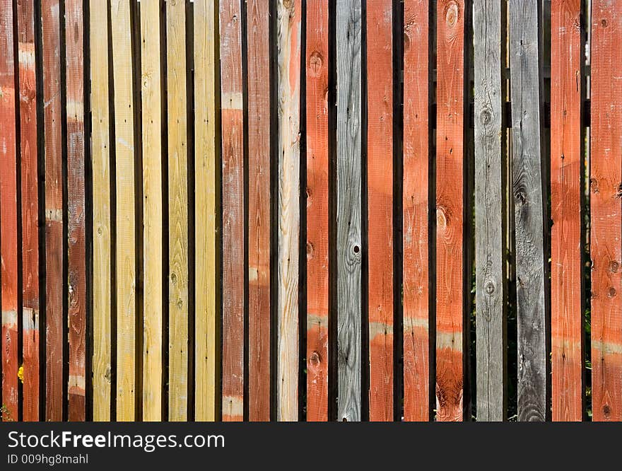 A photo of a color wooden fence