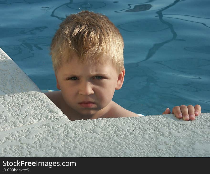 Young boy in the swimming pool