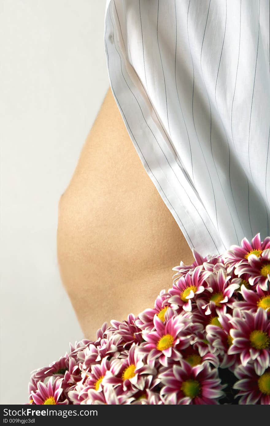 Image of woman belly and flowers. Image of woman belly and flowers