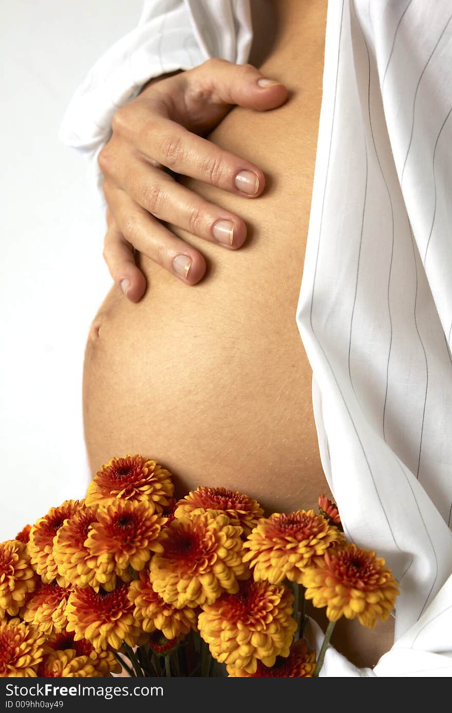 Woman's belly and red flowers