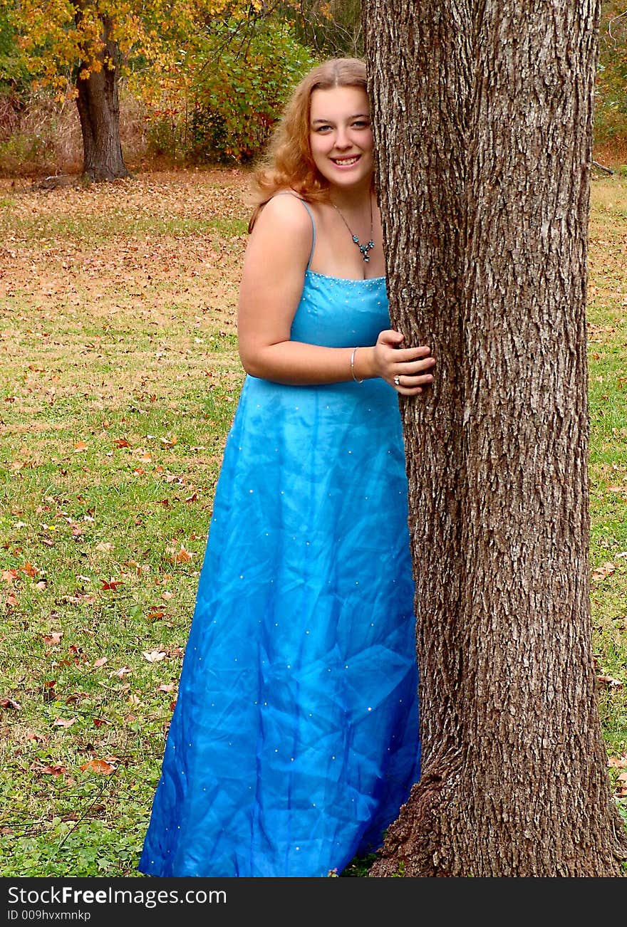 Pretty Teen by a Tree