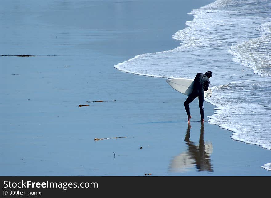 Man surfing at the beach in ca