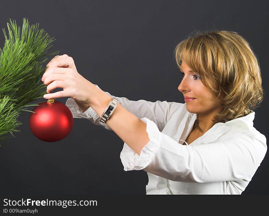 Women and christmas decorations on black. Women and christmas decorations on black