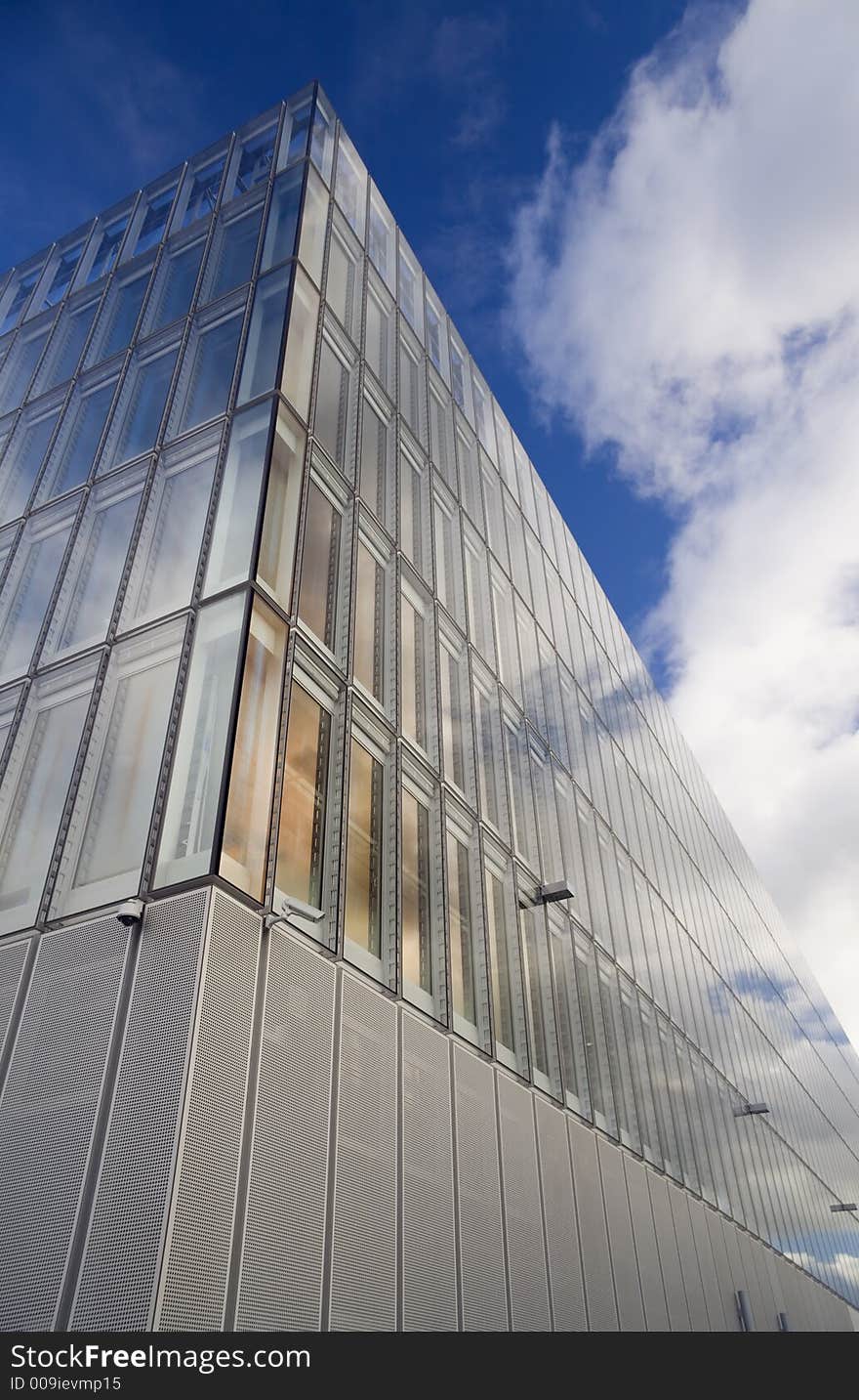 Glass faced office building against autumn sky. Glass faced office building against autumn sky