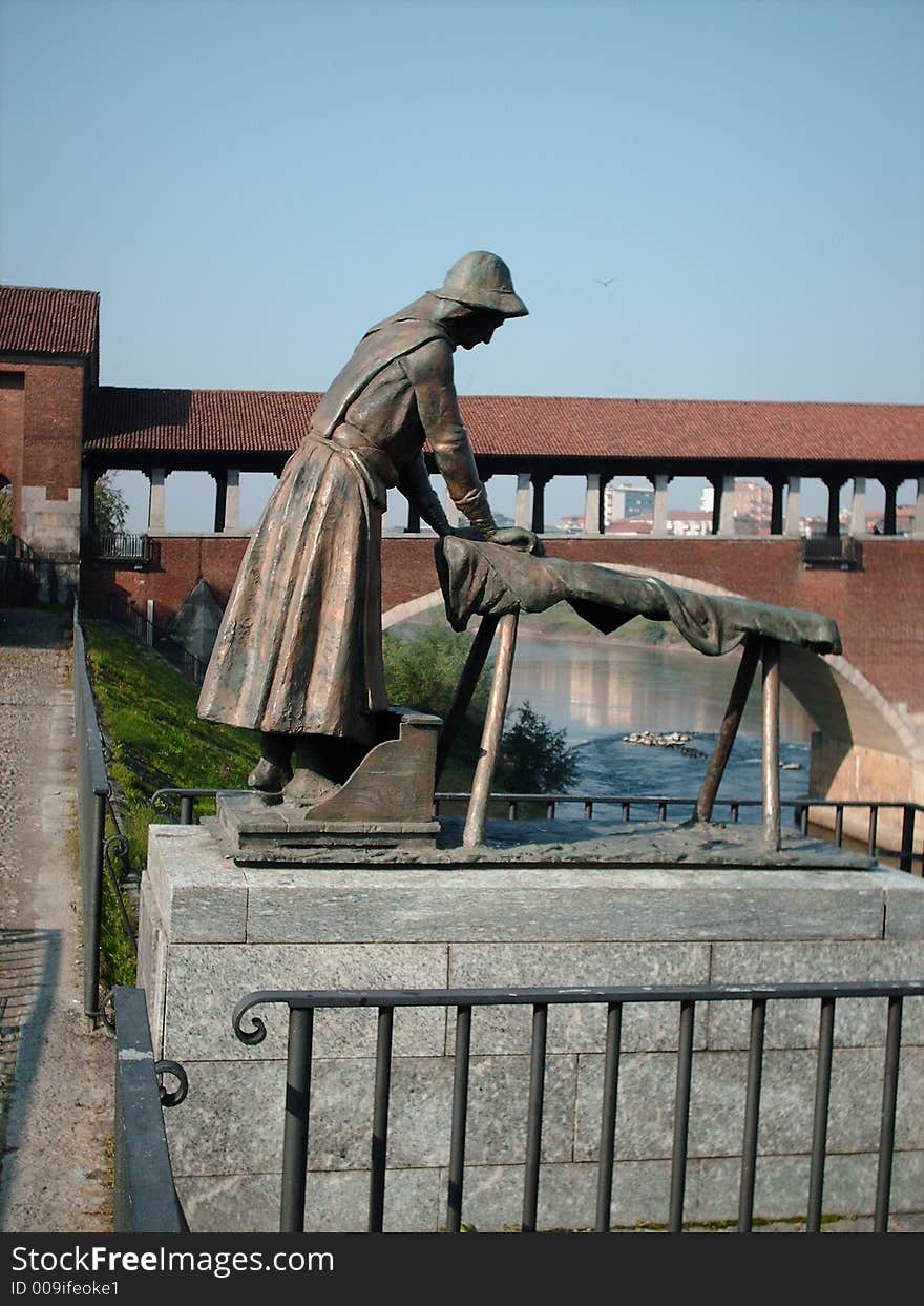 Pavia, Italy, woman that is washing the clothes, november 2006