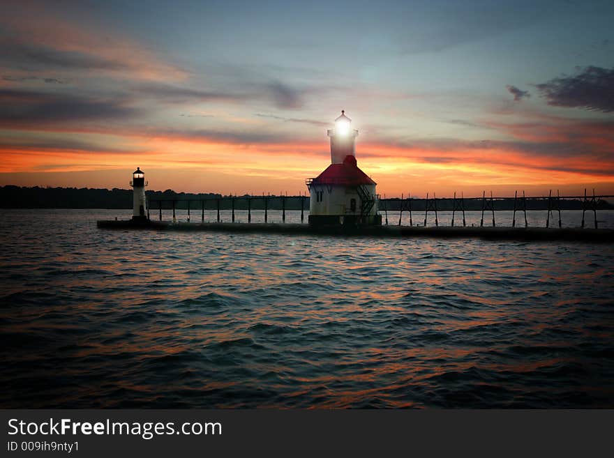 Lighthouse on lake with sunset. Lighthouse on lake with sunset.