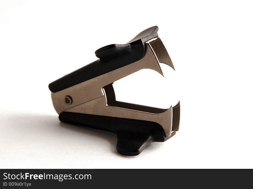 Common staple remover on white background