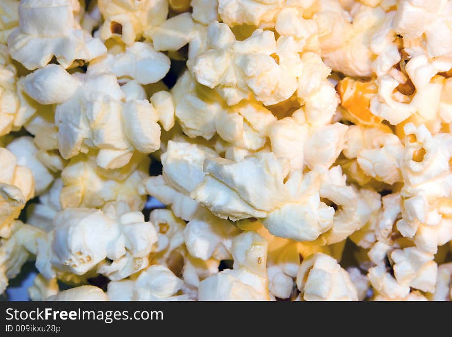 Freshly popped buttered popcorn as a background. Freshly popped buttered popcorn as a background.