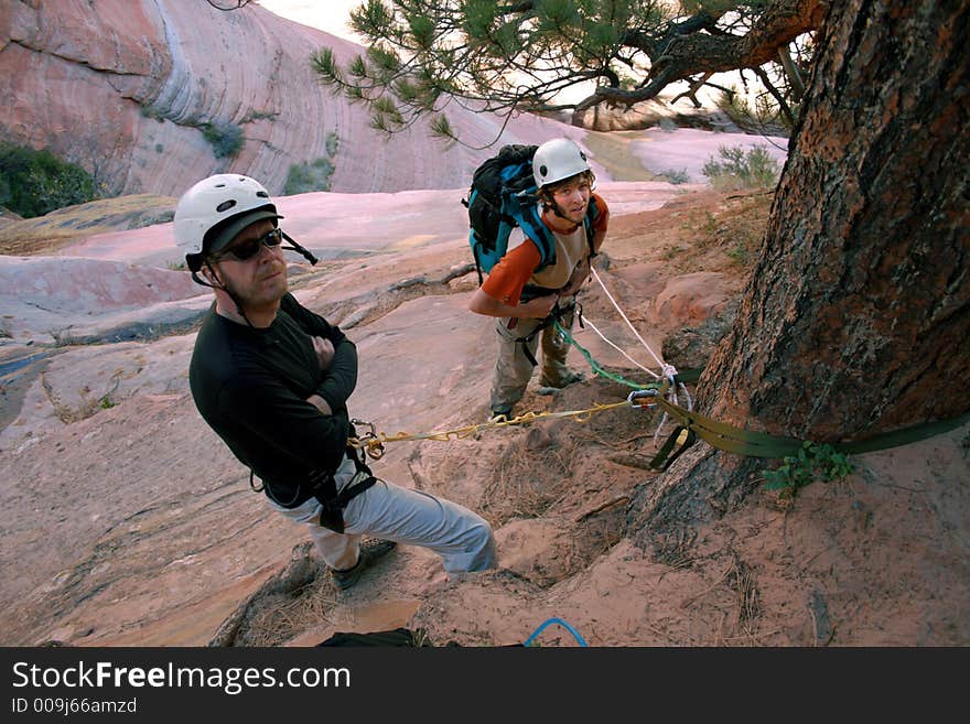 Technical descending in canyon country anchor station. Technical descending in canyon country anchor station