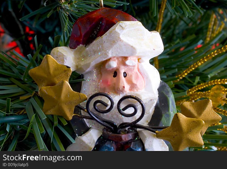 Close up of a Santa Claus decoration hanging on a christmas tree. Close up of a Santa Claus decoration hanging on a christmas tree