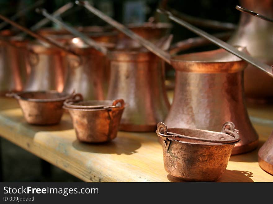 Metallic pots on an exhibition. Metallic pots on an exhibition