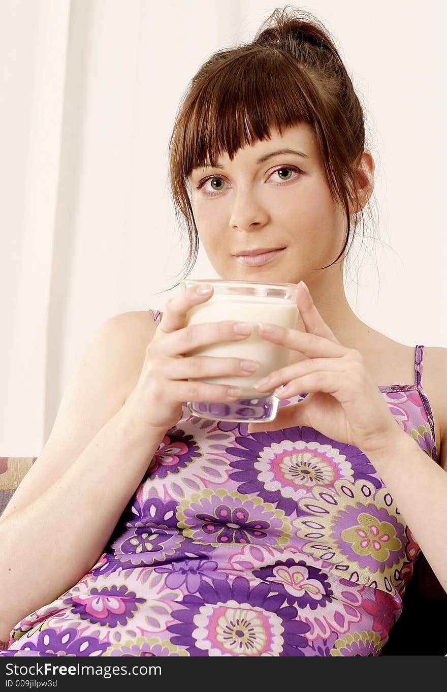 Young girl, woman milk from a glass -portrait. Young girl, woman milk from a glass -portrait