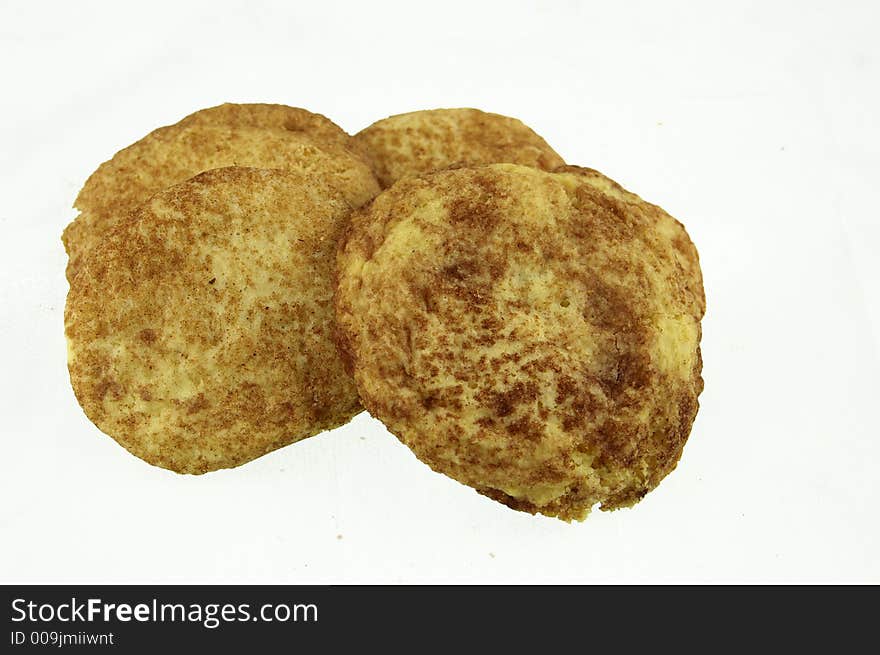 Four sugar cinnamon cookies on white background. Four sugar cinnamon cookies on white background