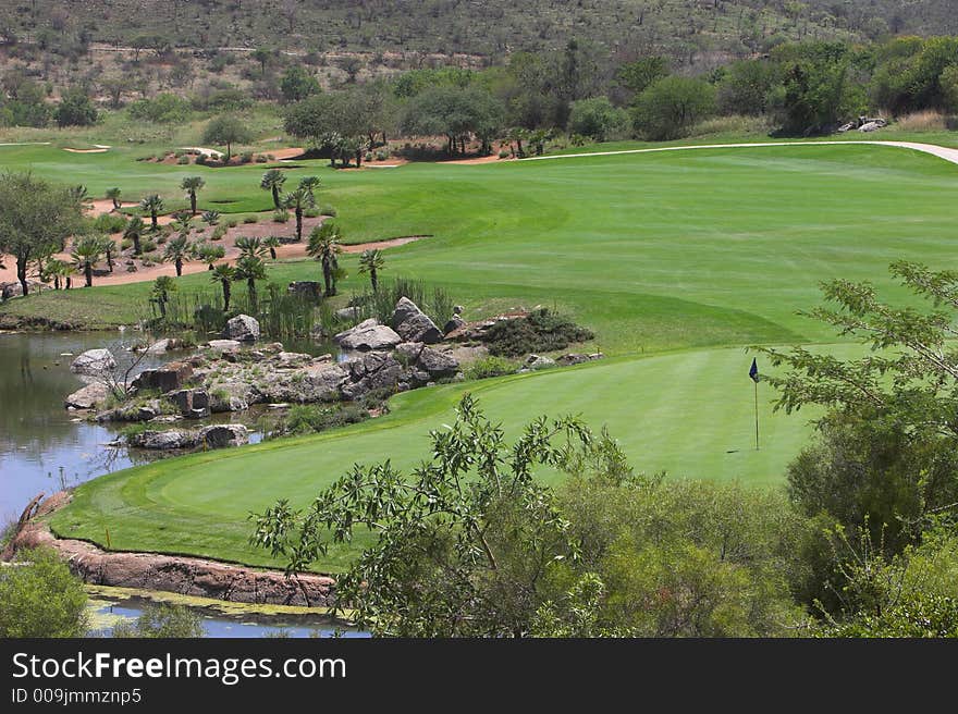 Difficult final hole over water and hazards. Difficult final hole over water and hazards