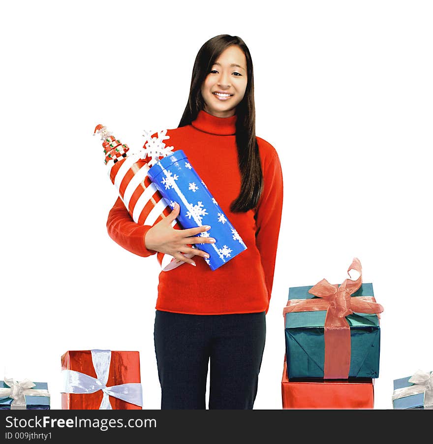 Girl standing with presents on a white background. Girl standing with presents on a white background.