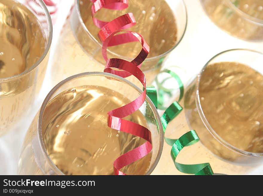 Wine glasses with ribbons and confetti. Wine glasses with ribbons and confetti