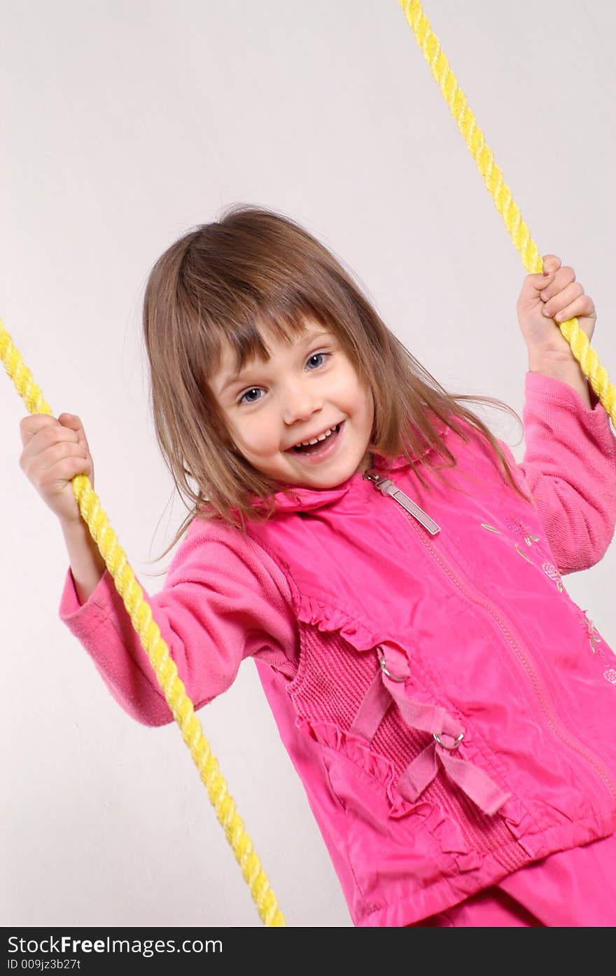 Little girl on the swing. Little girl on the swing