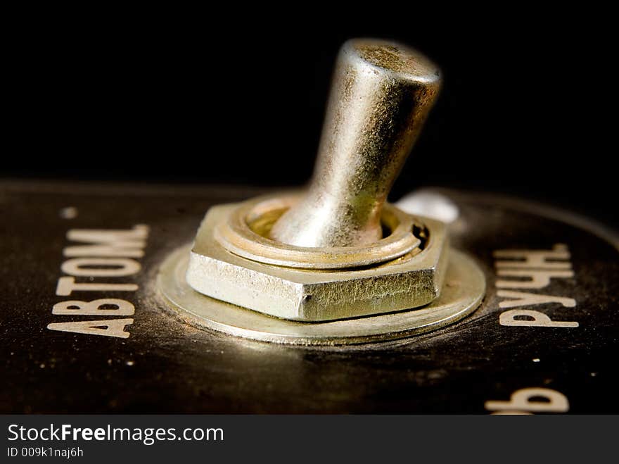 Old-fashioned metal switch close-up. Old-fashioned metal switch close-up