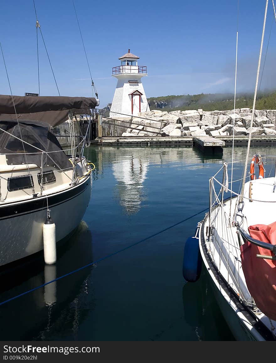 A reflection of a lighthouse at a northern Ontario marina. A reflection of a lighthouse at a northern Ontario marina.