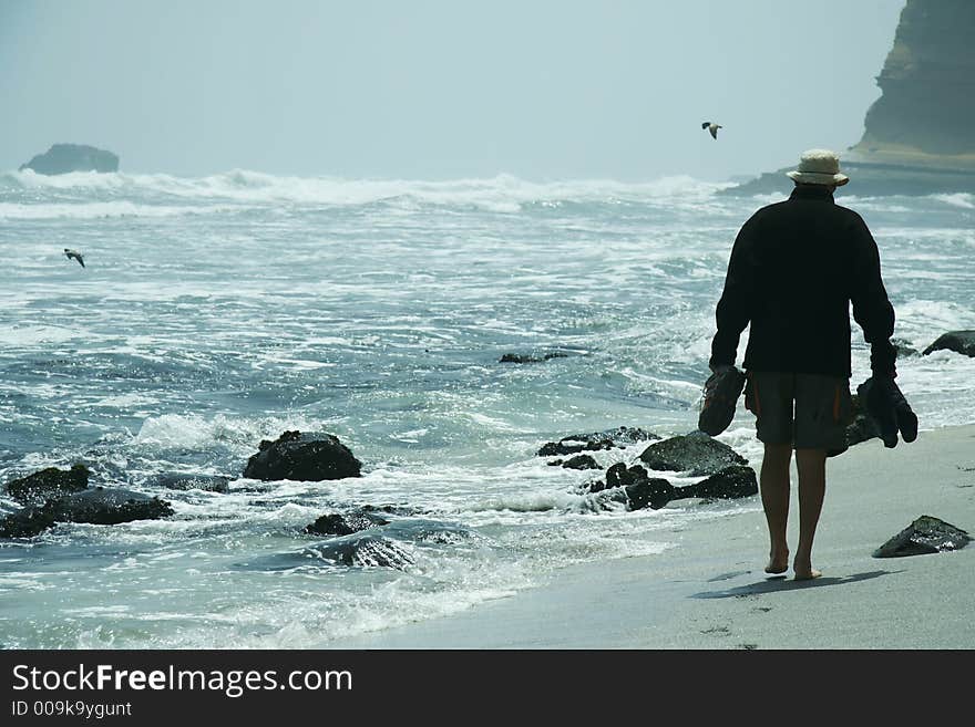 Male going along ocean coast. Male going along ocean coast