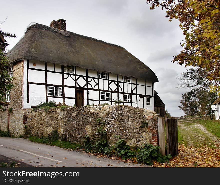 Quaint Thatched Timber Framed Village Cottage in a Rural England. Quaint Thatched Timber Framed Village Cottage in a Rural England