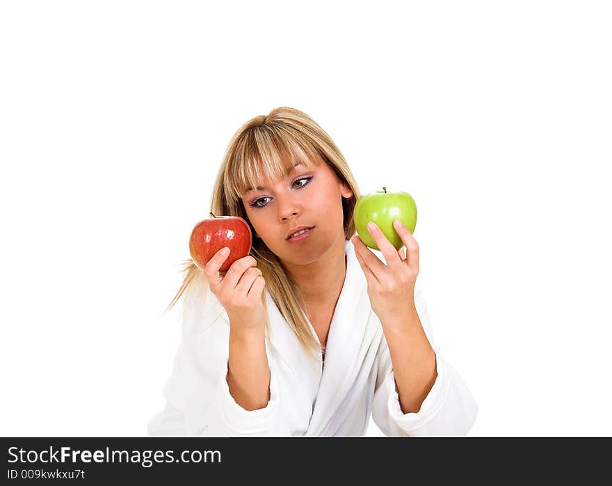 Young girl with two apples. Focused on apples.