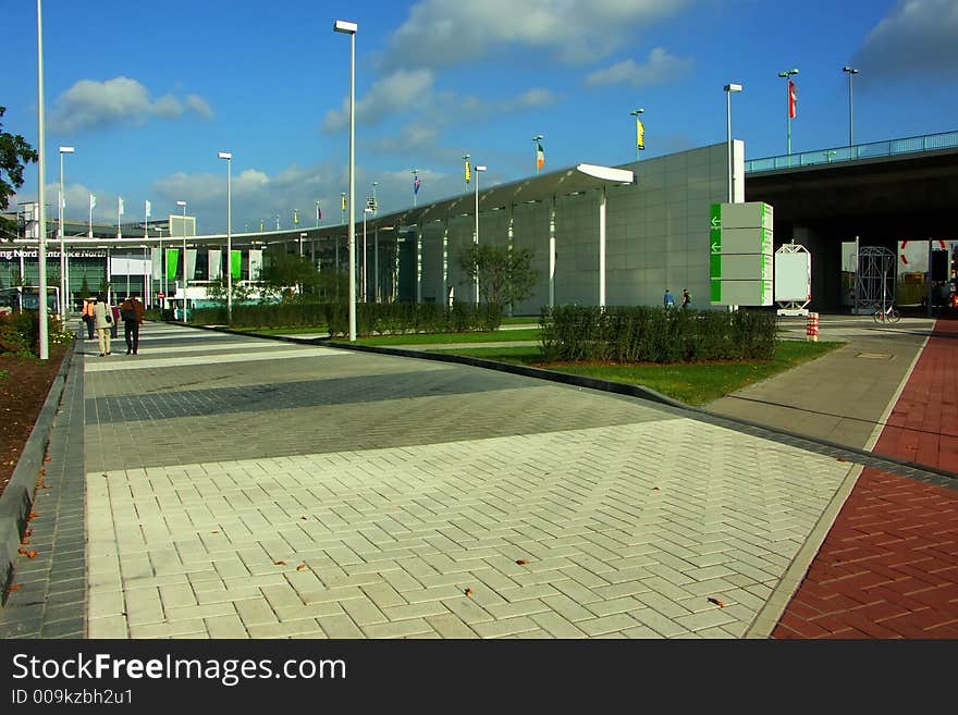 Buildings from glass and concrete on a background of the morning blue sky. Buildings from glass and concrete on a background of the morning blue sky