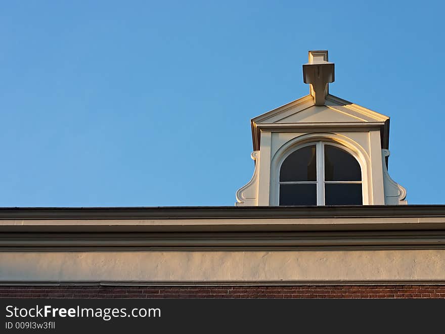 Historic dutch chapel against a clear blue sky