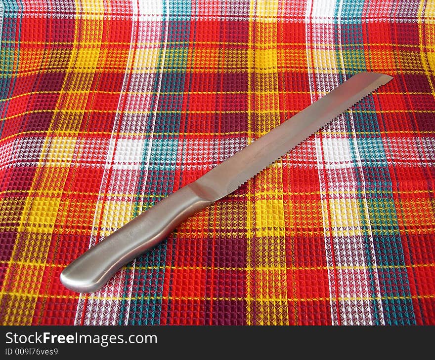 Knife on a checkered fabric