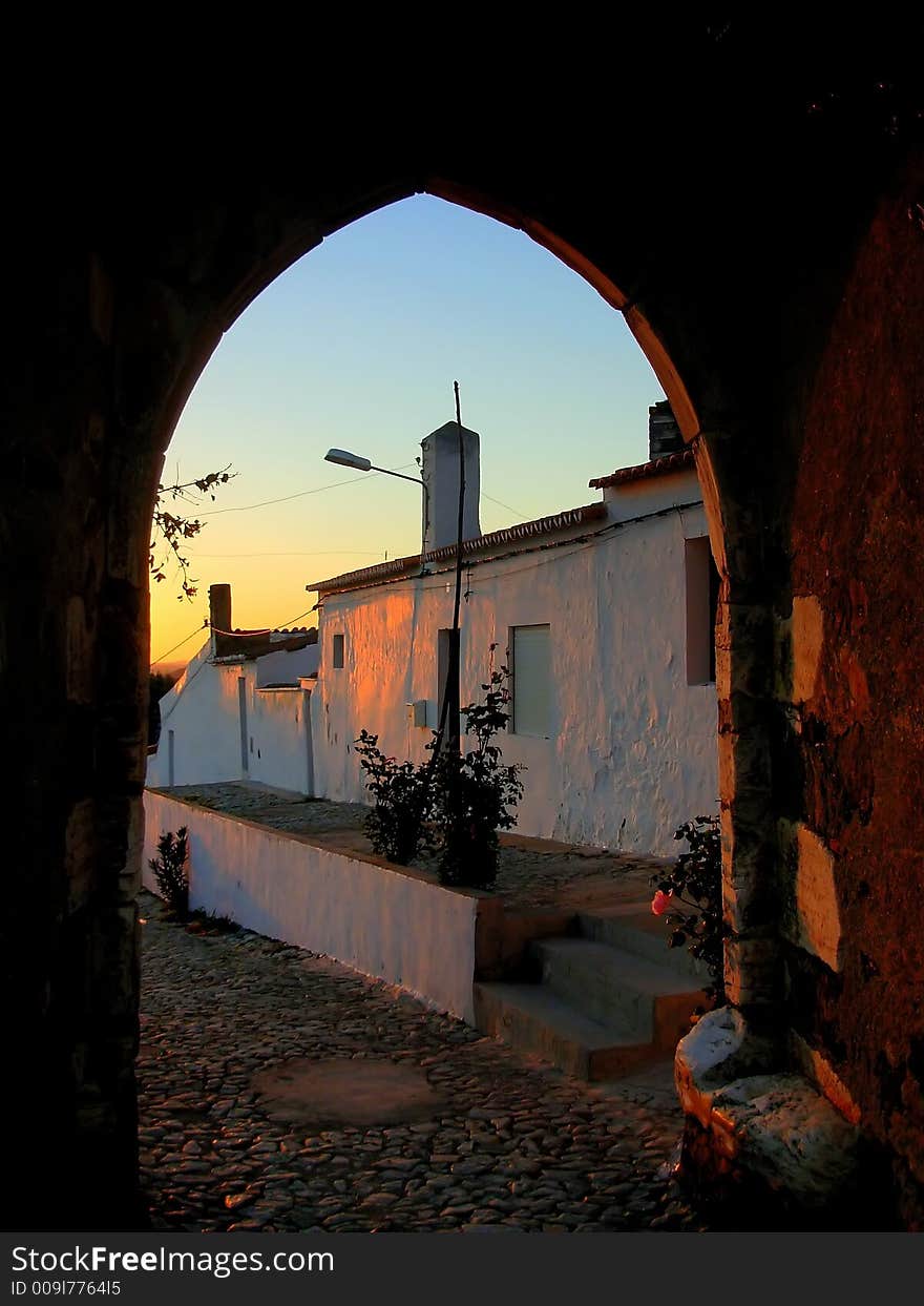 Urban landscape to the together twilight to the door of medieval castle. Portel, Portugal