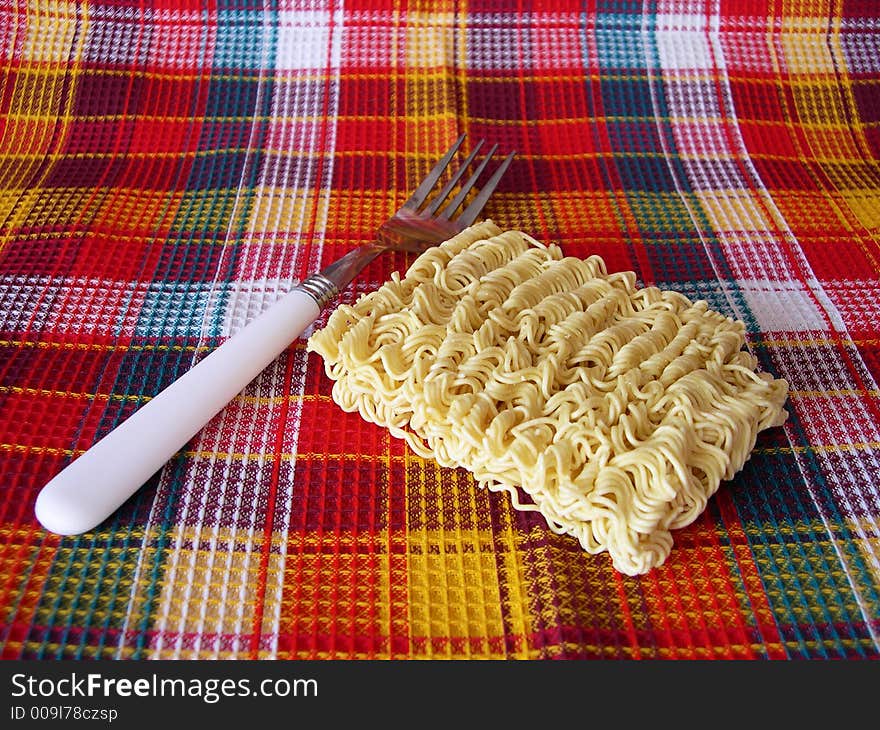 Noodles on a checkered fabric