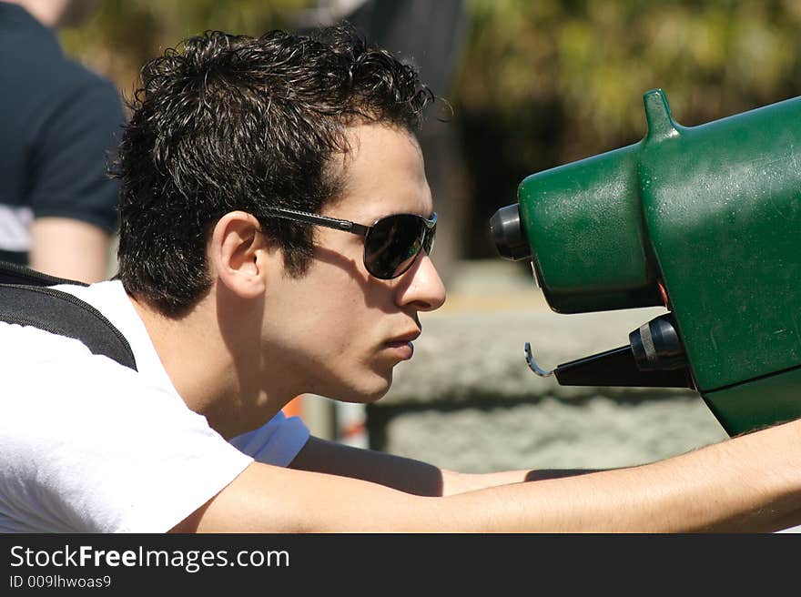 A young man  looking through a telescope II. A young man  looking through a telescope II