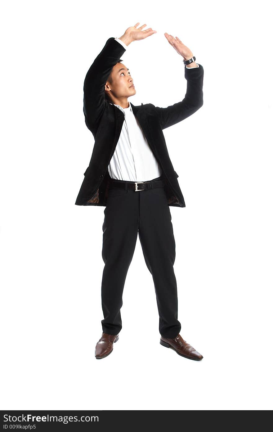 Great looking asian businessman shot in studio - holding. Great looking asian businessman shot in studio - holding