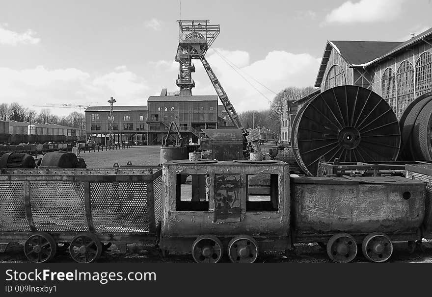 Mining company with an old mining treein front of the picture. Mining company with an old mining treein front of the picture.