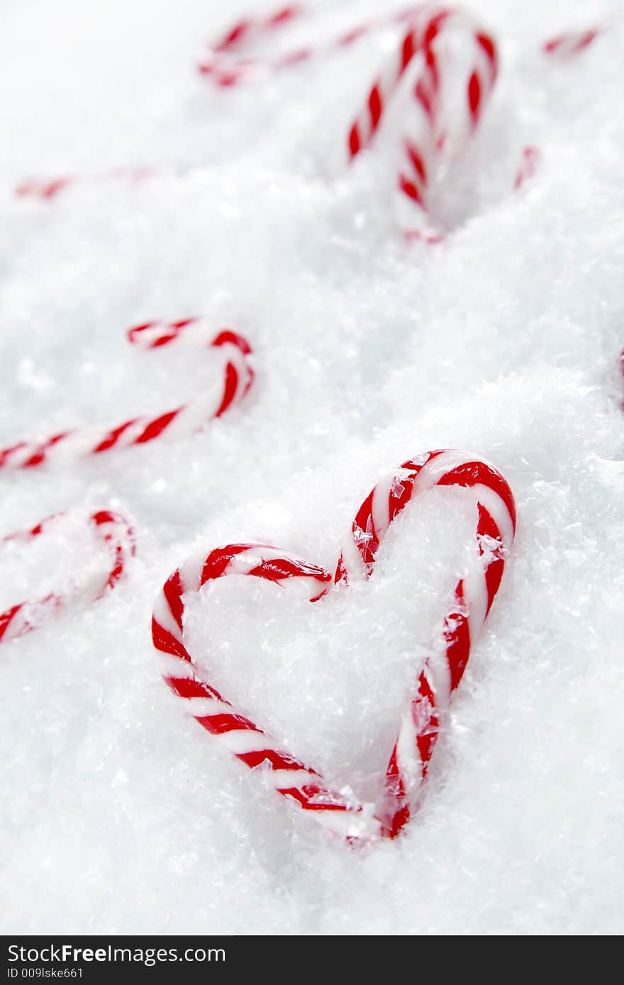 Miniature candy canes shaped like a heart. Miniature candy canes shaped like a heart