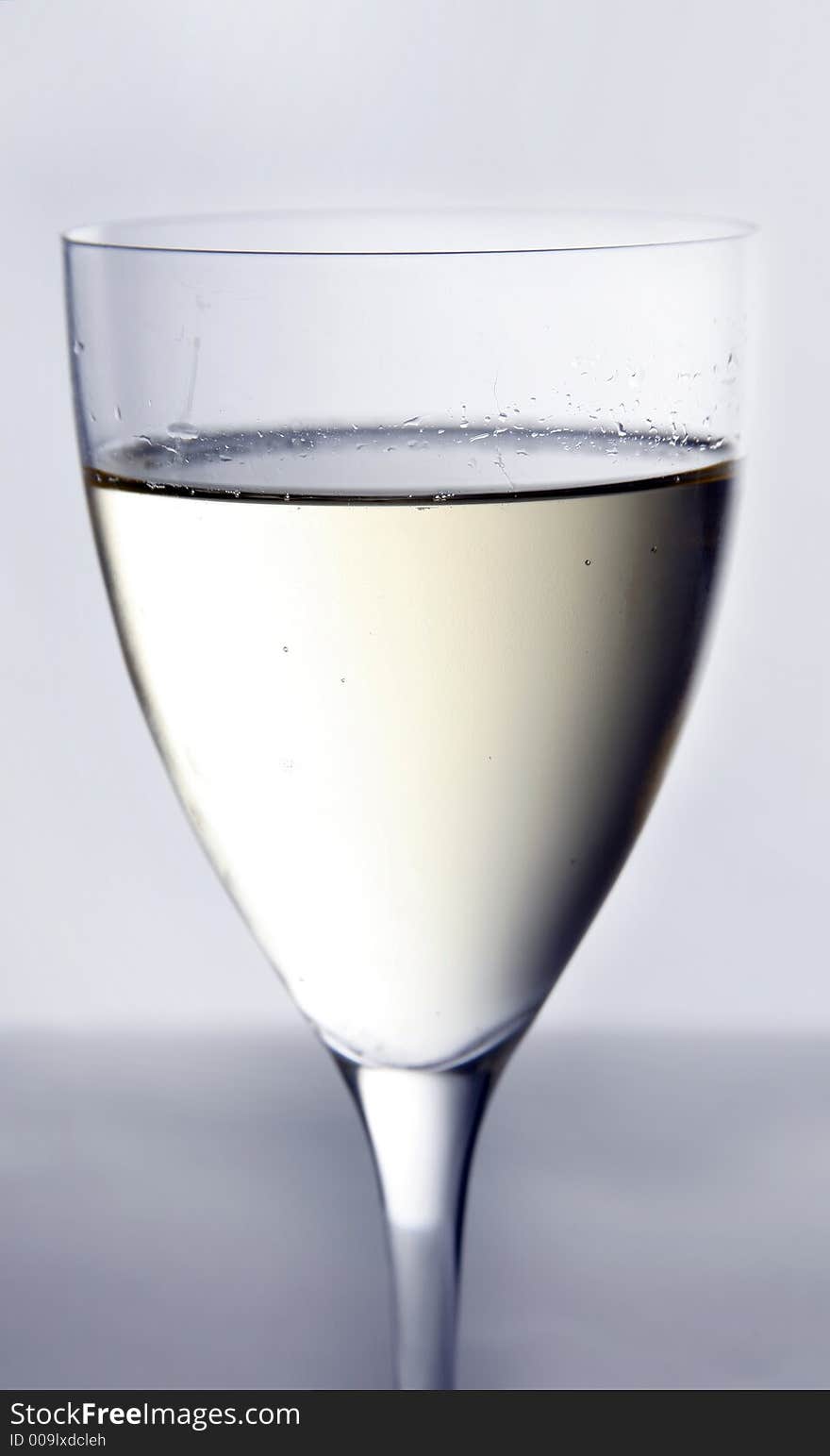 A cold, tall glass of white wine