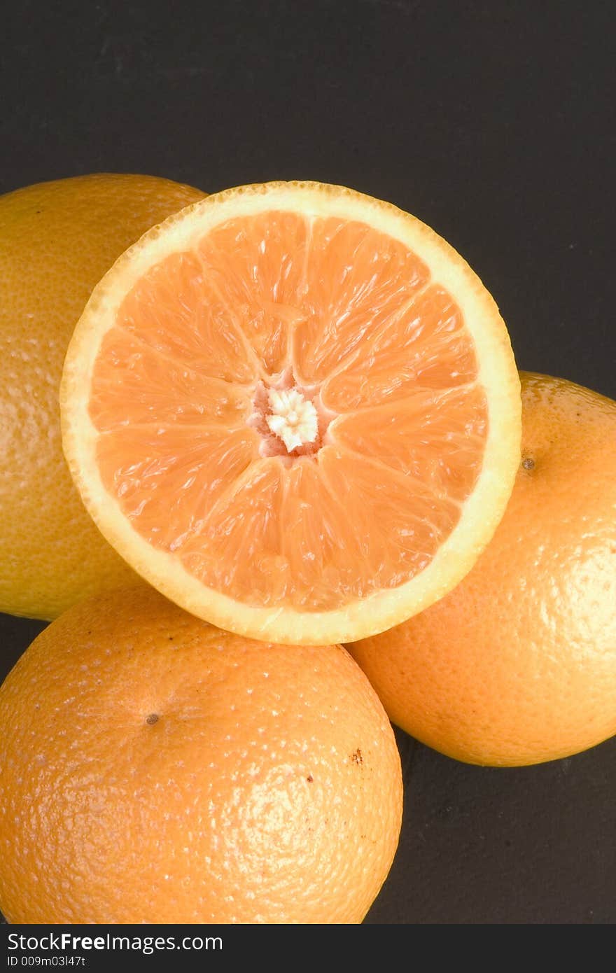 Oranges with sliced half orange