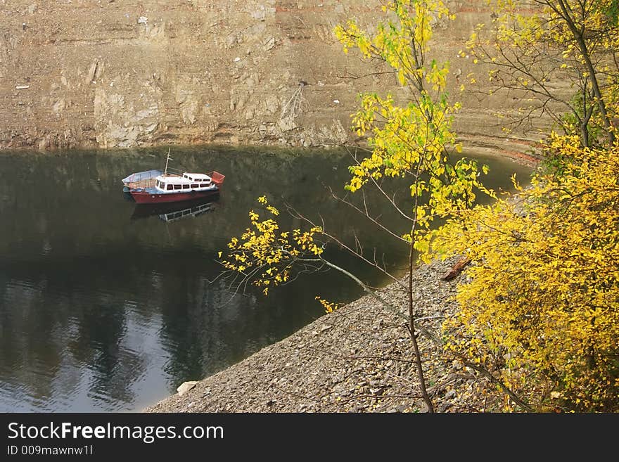 Isolated boats at Vidraru Dam - Romania, 166 m hight, 465 millions mc, build in 1966