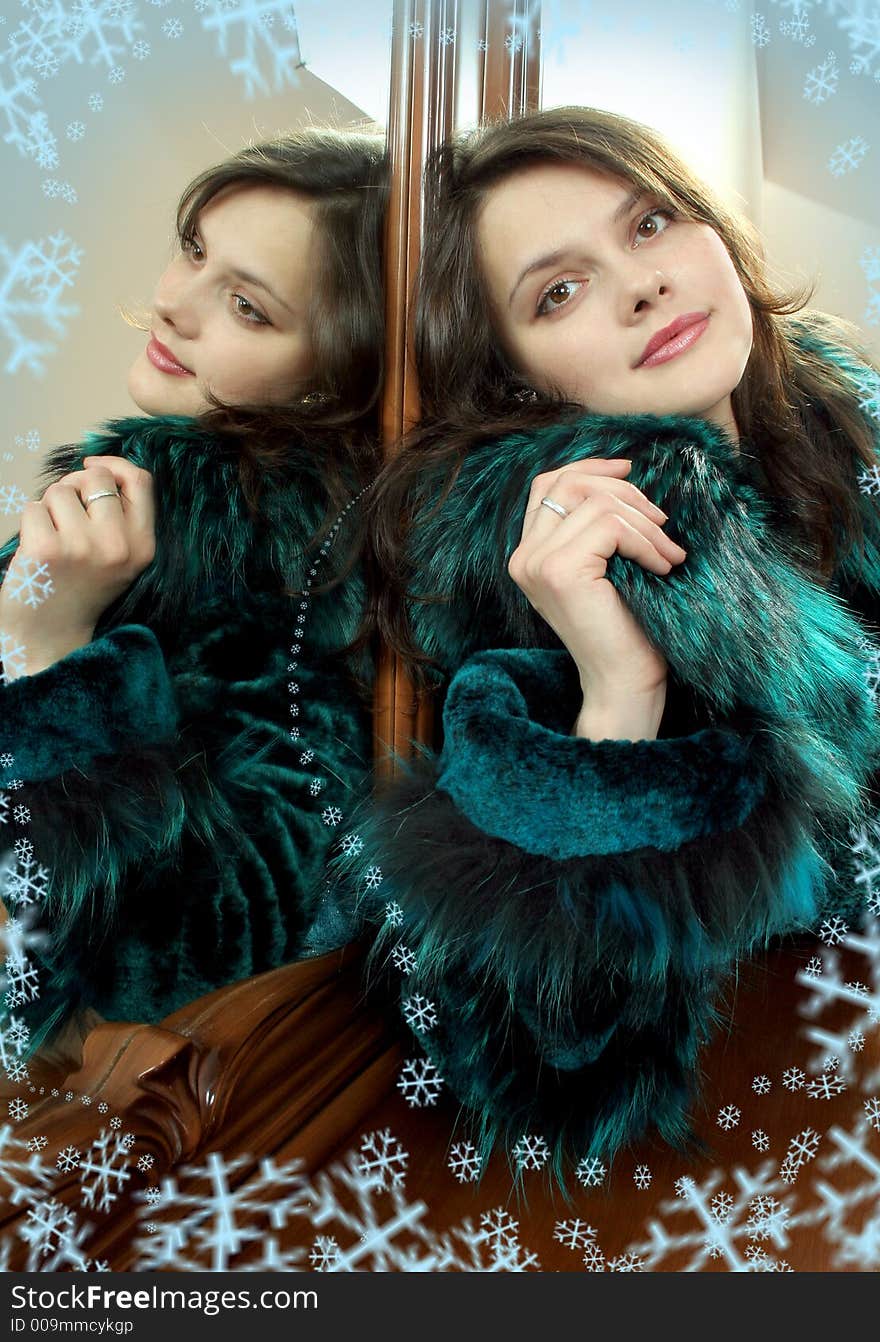 Lovely young woman in furcoat