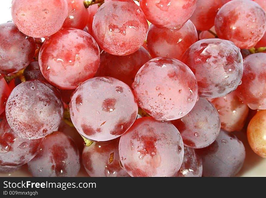 Seasonal grapes with leaves on white. Seasonal grapes with leaves on white