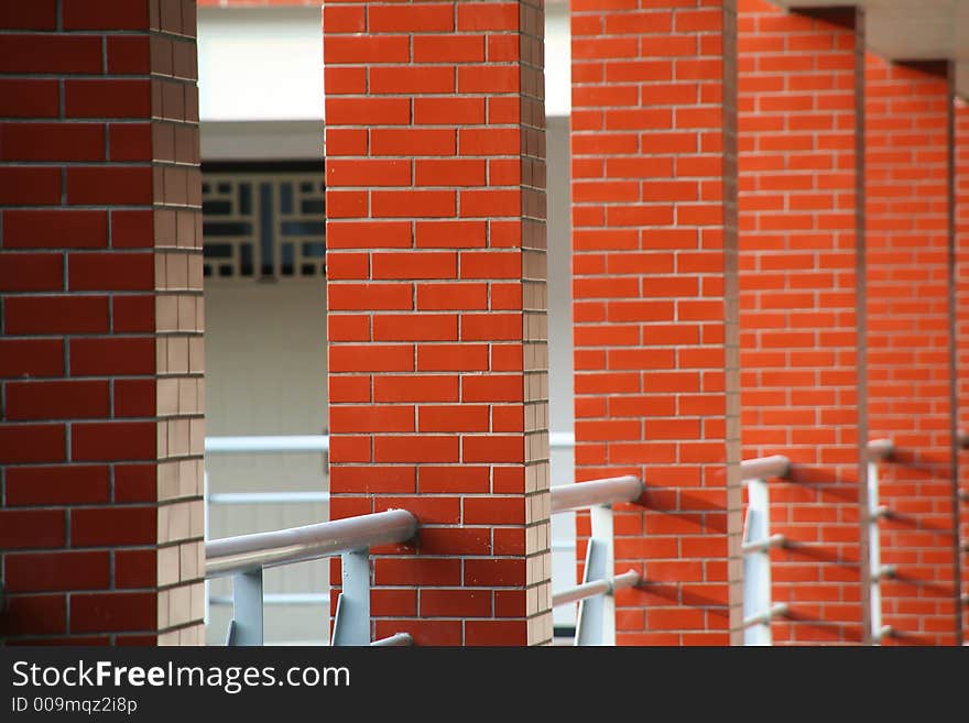 red pillar inside building in campus city. red pillar inside building in campus city